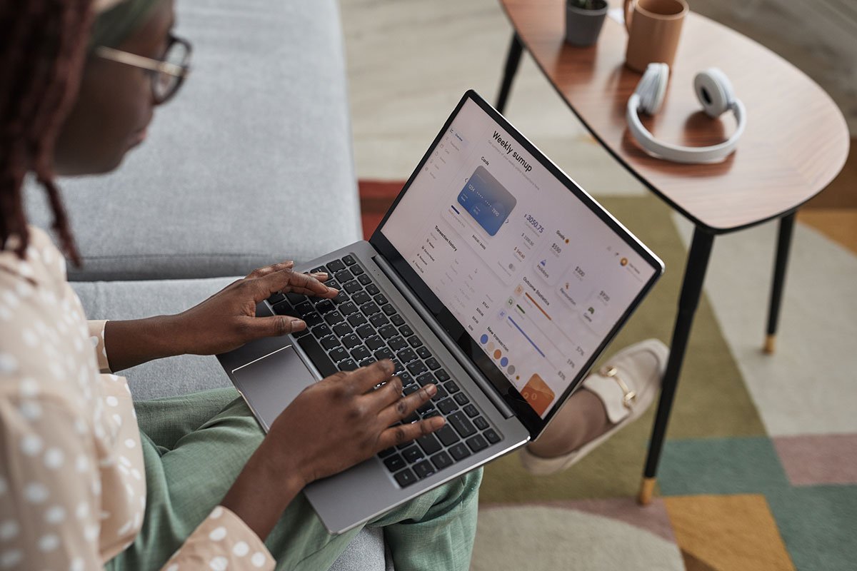 Woman working on a WordPress website maintenance dashboard on her laptop.