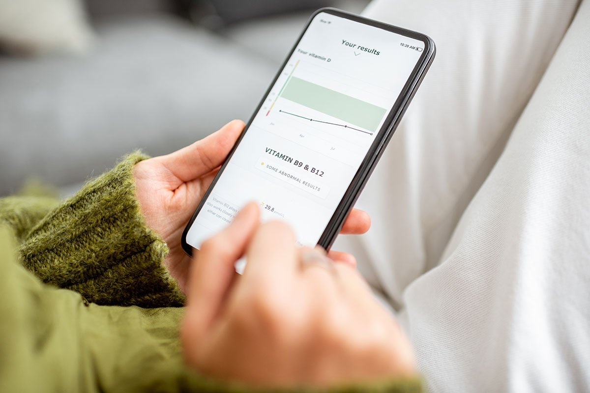 Person viewing health results on a mobile app, showcasing mobile optimization.